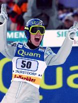 Germany's Sven Hannwald, winner of Sunday's Four Hills opener in Oberstdorf, gives victory wave to the home crowd after his 125 meters
jump.